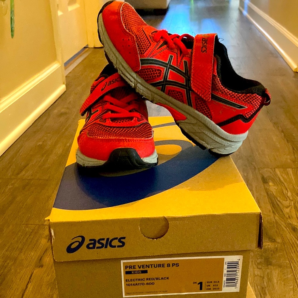 Red kids ASICS size 1.